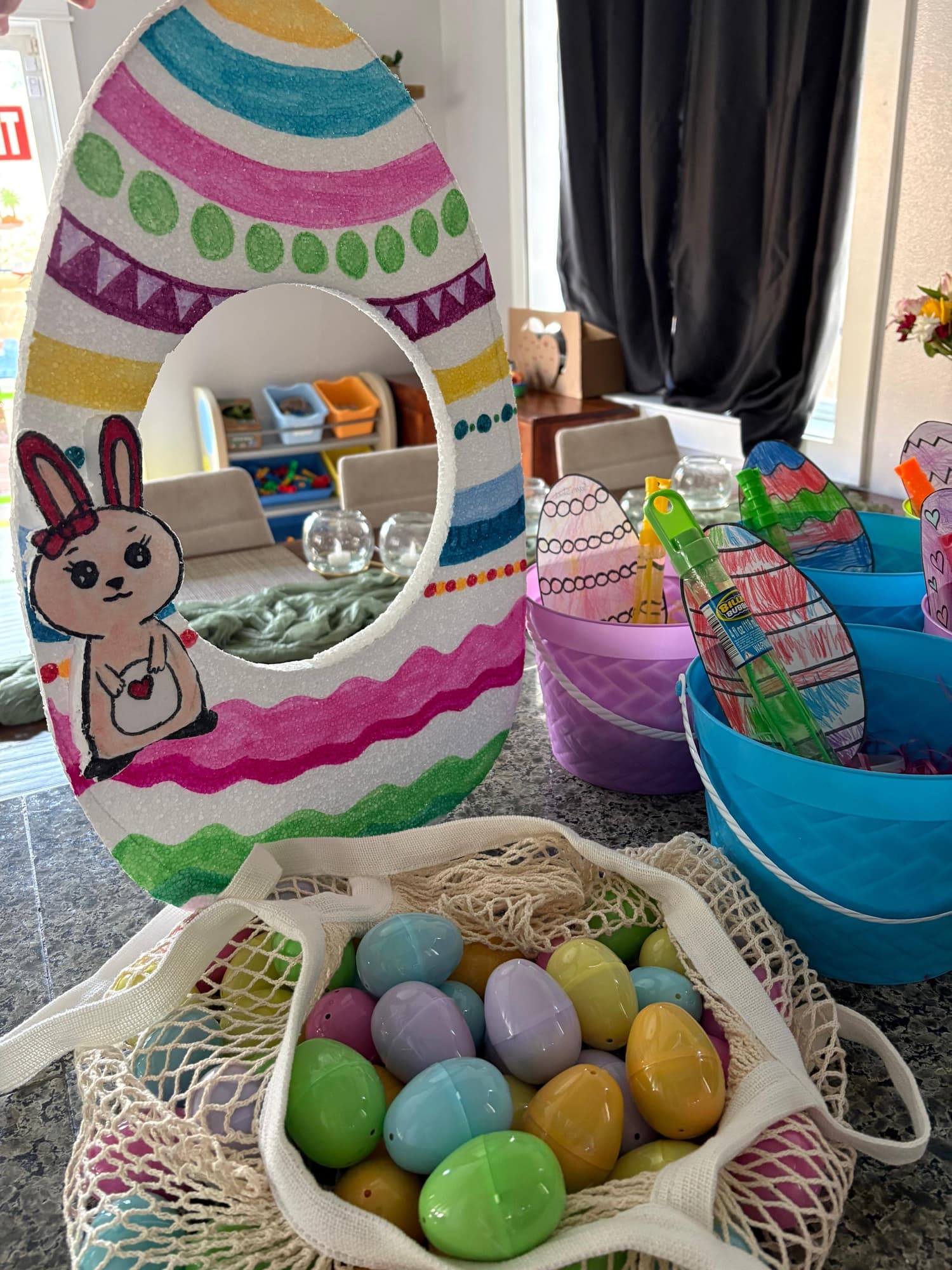 Decorative Easter egg craft with bunny in colorful baskets